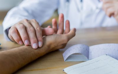 crop-doctor-checking-pulse-patient