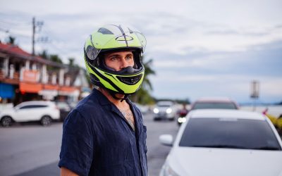 portrait-male-biker-yellow-helmet-side-busy-road-thailand-sunset-time